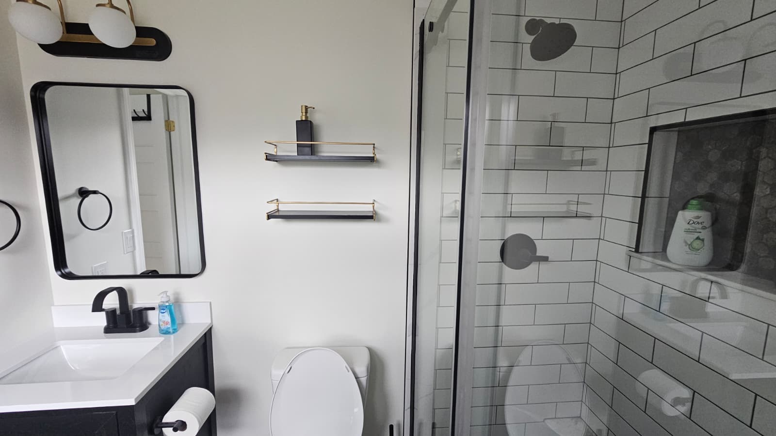 Modern bathroom with rainfall shower and premium fixtures